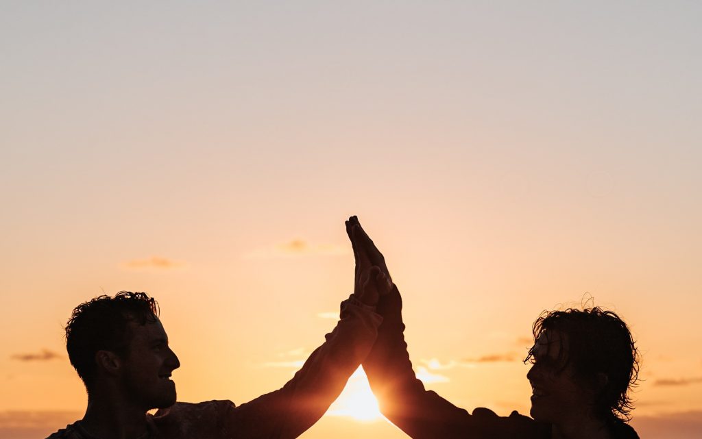 Partners high-fiving